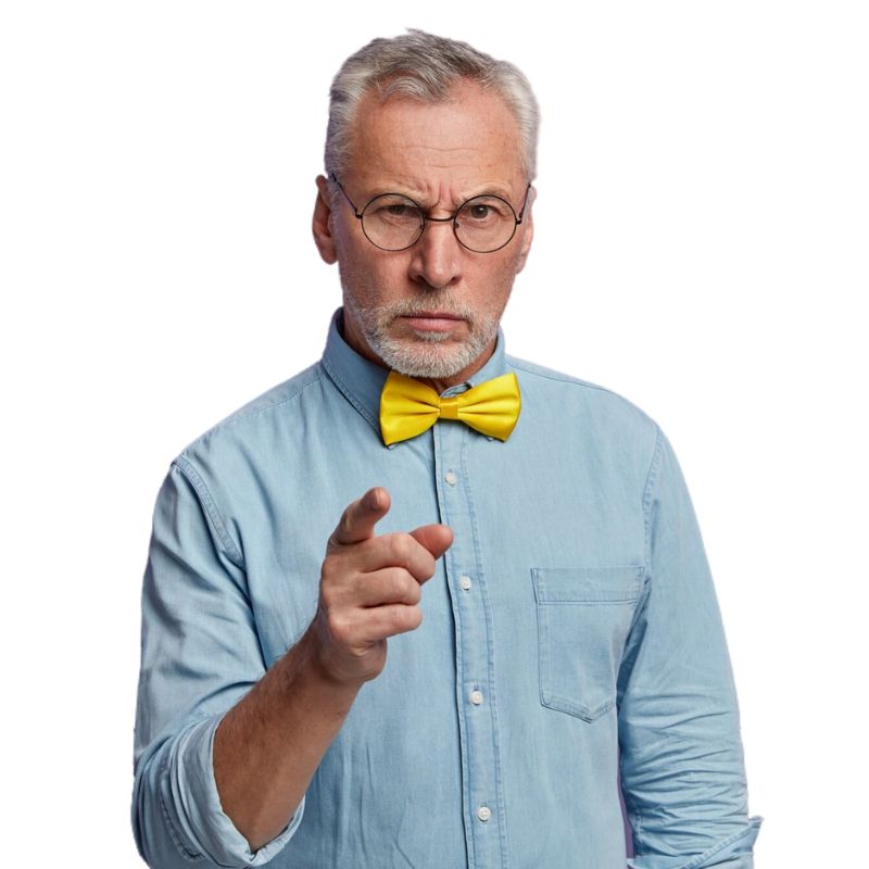 An older man with glasses and a yellow bow tie, wearing a light blue button-up shirt, points forward with a serious expression.
