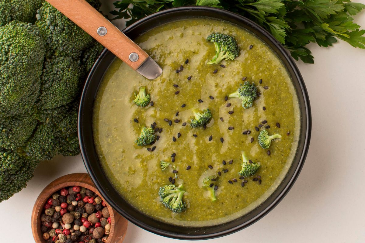 a bowl of candida-fighting green detox soup with handle of spoon within