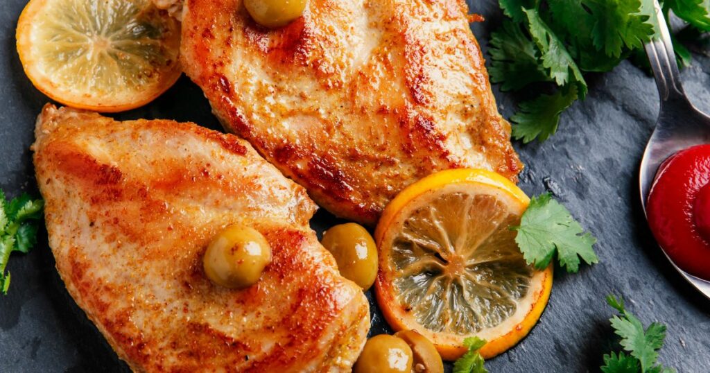 Roasted turkey breast with fresh lemon slices and herbs, a Candida-friendly holiday main dish rich in flavor and gut-supportive ingredients.