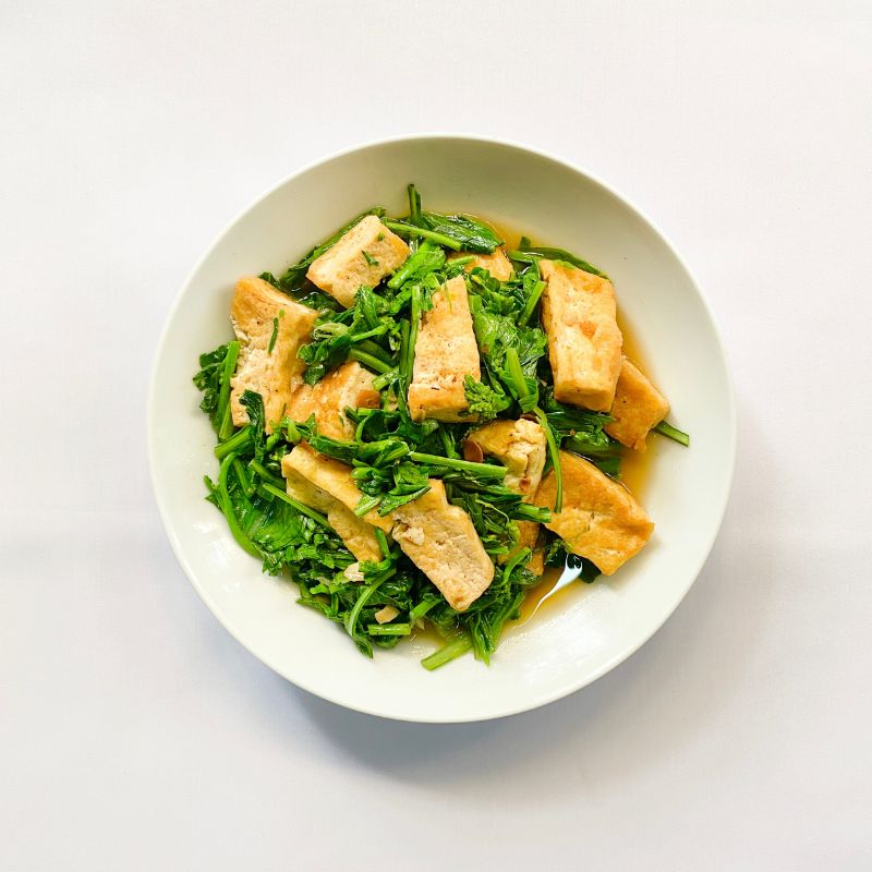 a plate of tofu with gingered bok choy stir-fry